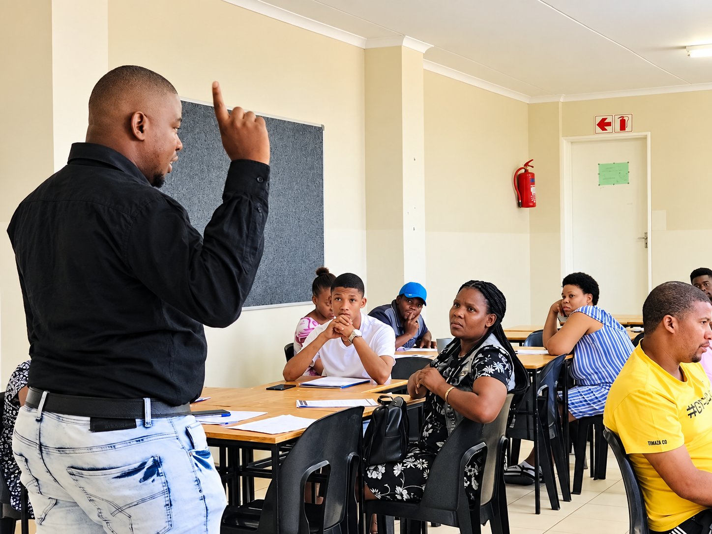 Adult learners taking part in a community training session